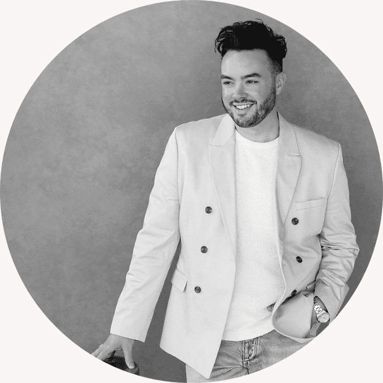 Kaleb Norman James in a light-colored blazer over a white shirt
